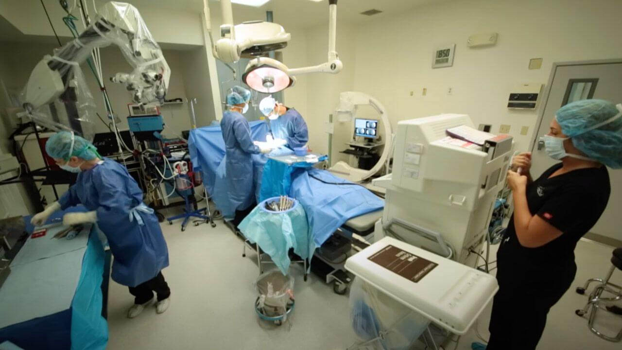 Doctors in an operating room operating on a patient