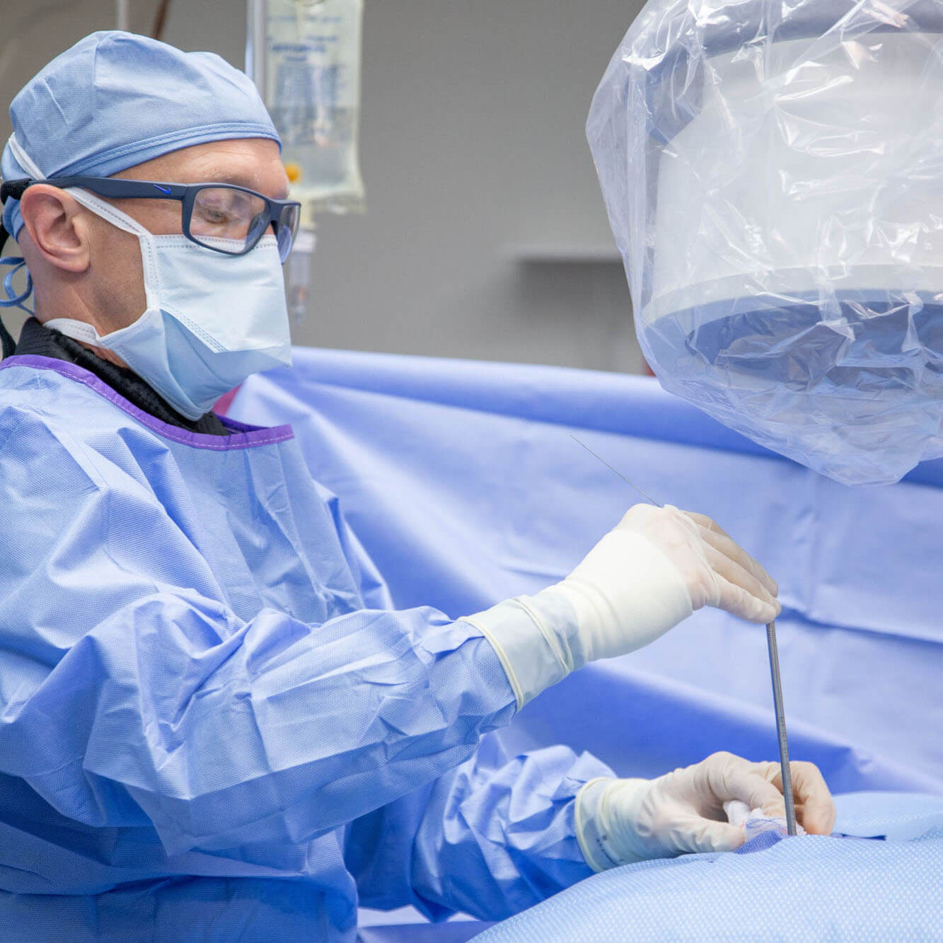 Doctor performing surgery in the operating room.