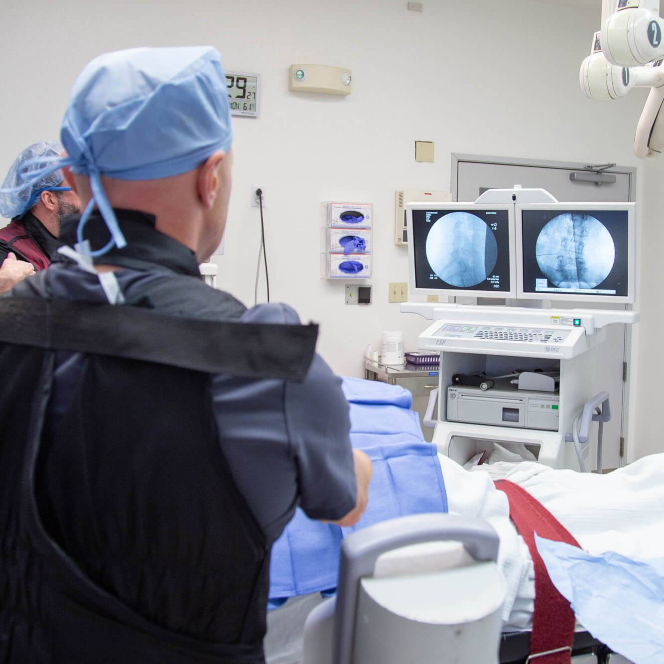 Doctor performing surgery in the operating room.