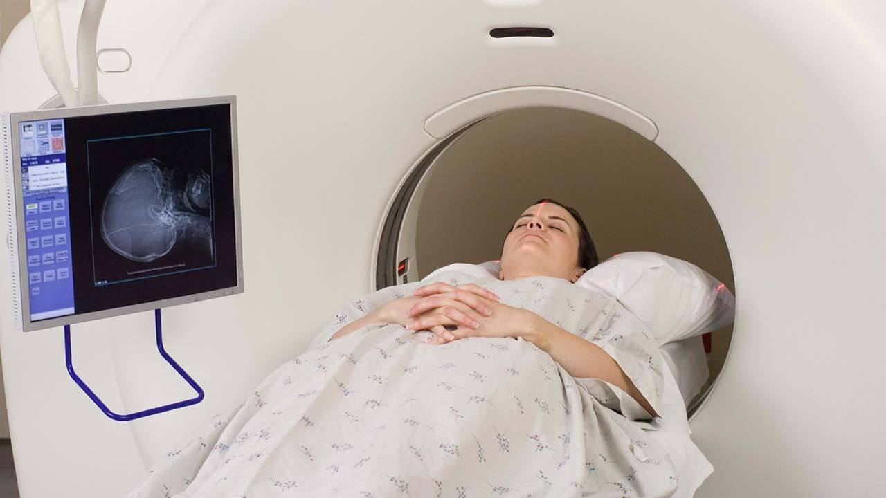 Woman having an MRI of her neck done