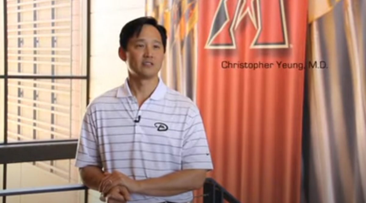 Christopher Yeung M.D. in a White Arizona Diamondbacks Shirt