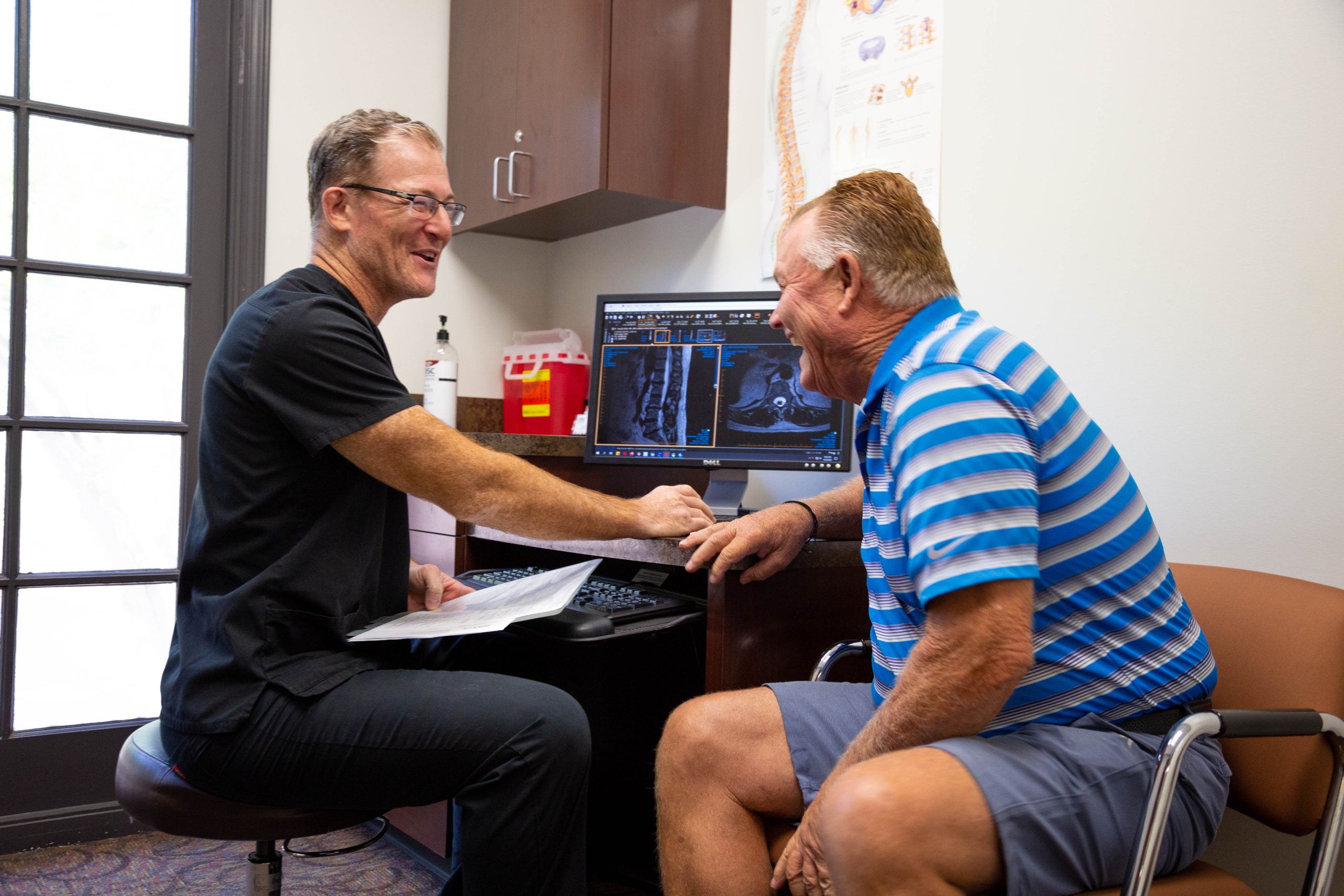 Doctor Laughing with Patient