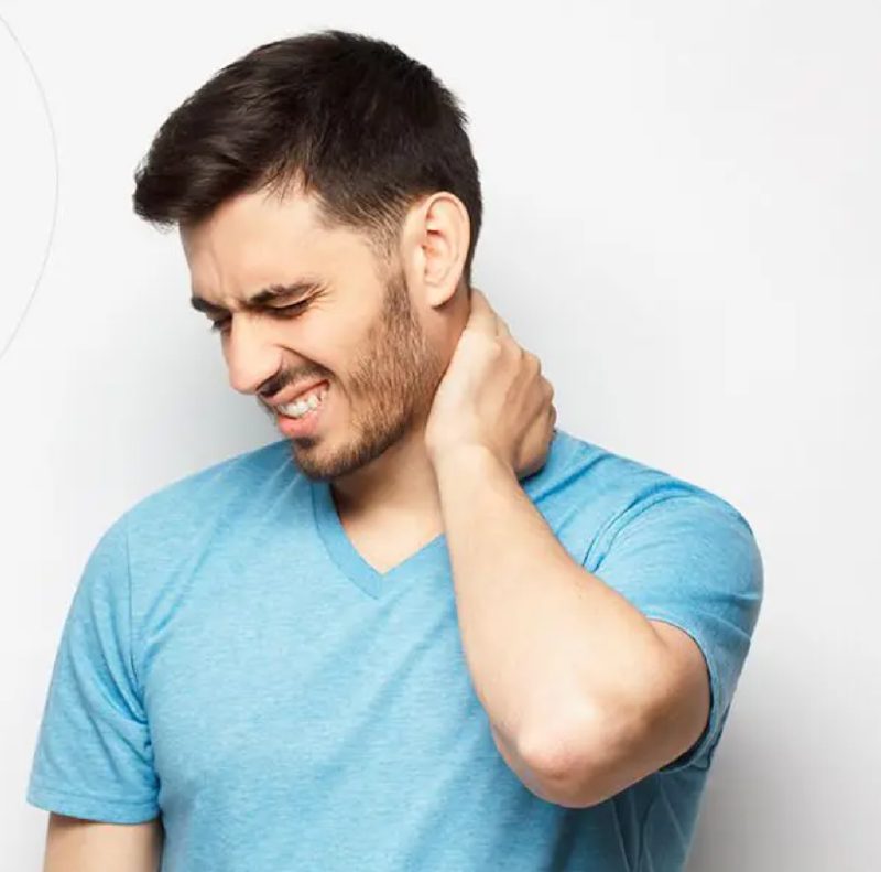 Man grabbing neck in pain