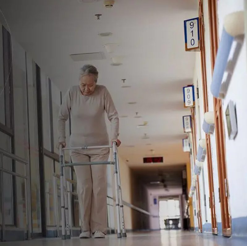 Woman walking with a walker