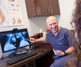 Dr Abrams laughing with patient