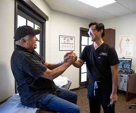 Dr Chris Yeung and patient